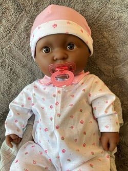 Image of a baby doll with a pacifier
