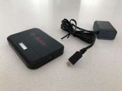 Image of a black wifi hotspot and a cord
