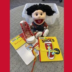 Image of puppet with a wooden shoe and two books